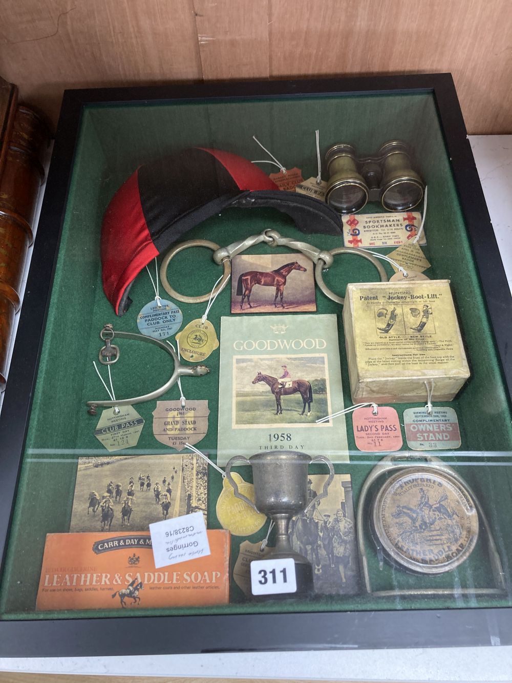 Horse racing memorabilia, arranged and contained in a glazed case, over height 56cm width 46cm